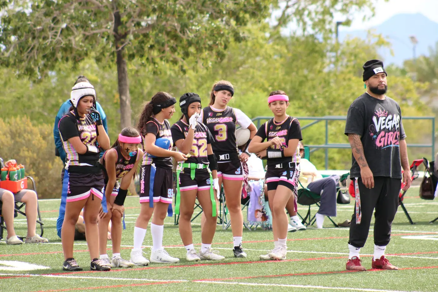 Vegas Girls athletes ready along the sideline